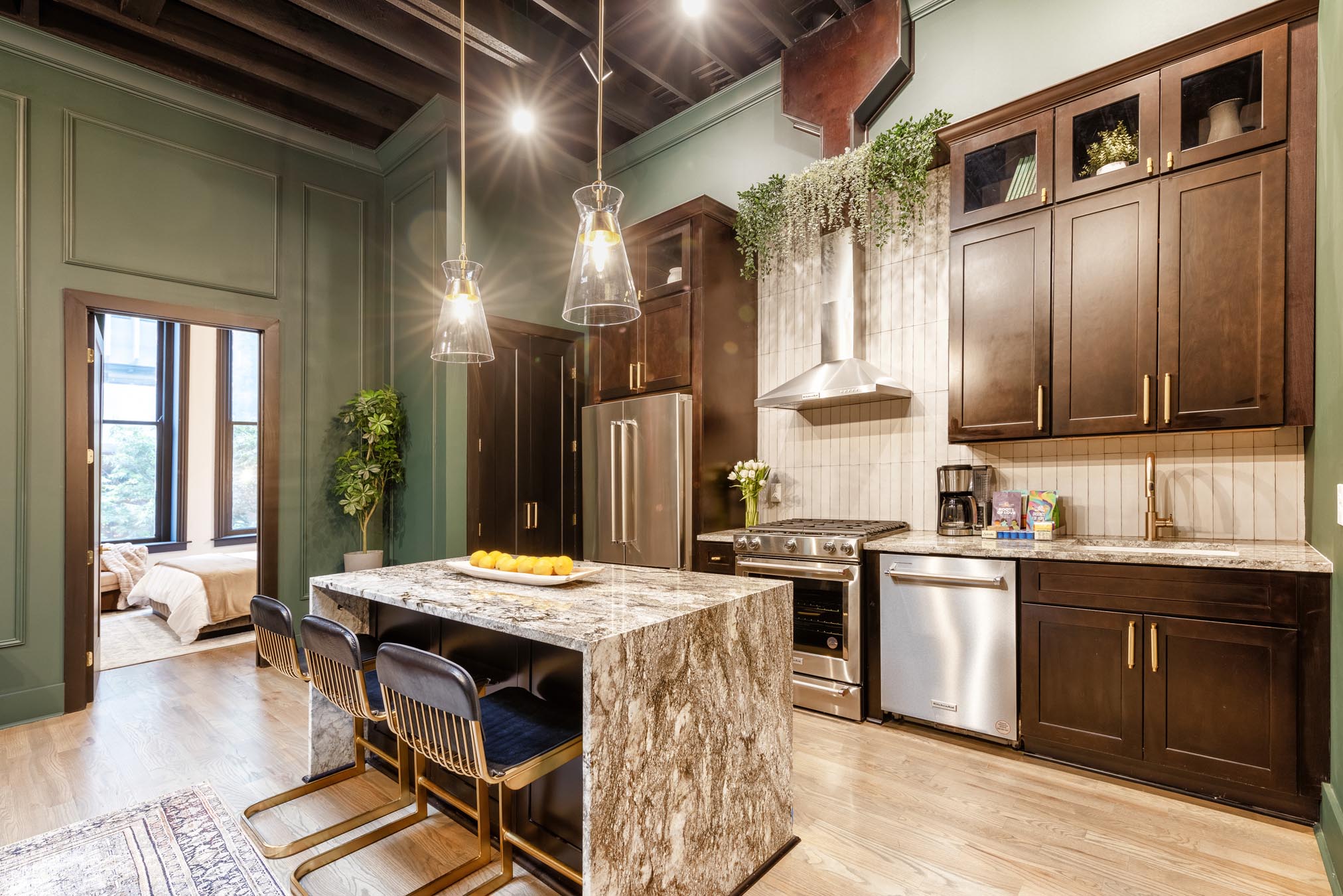 Kitchen with granite countertops and nice lighting fixtures